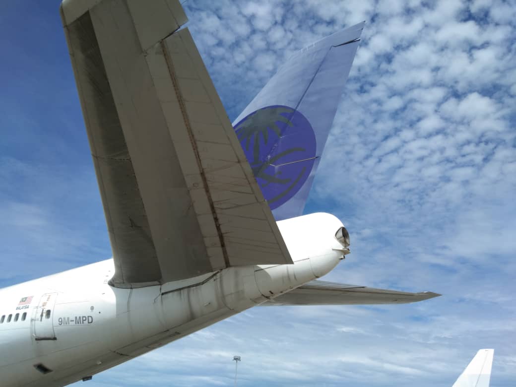 Boeing 747 tail section showing registration 9M-MPD